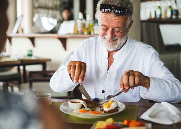 a man eating breakfast